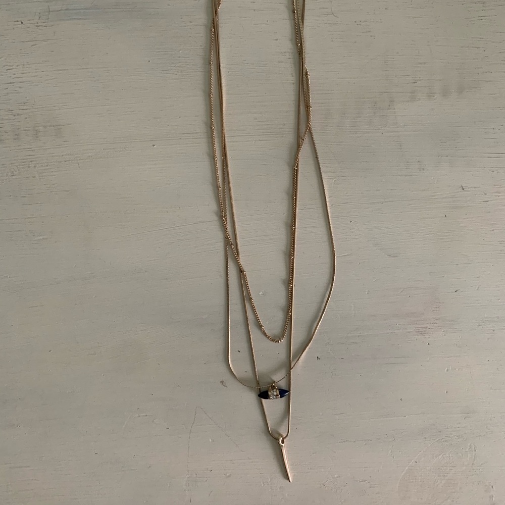 Gold layered necklace with different charms